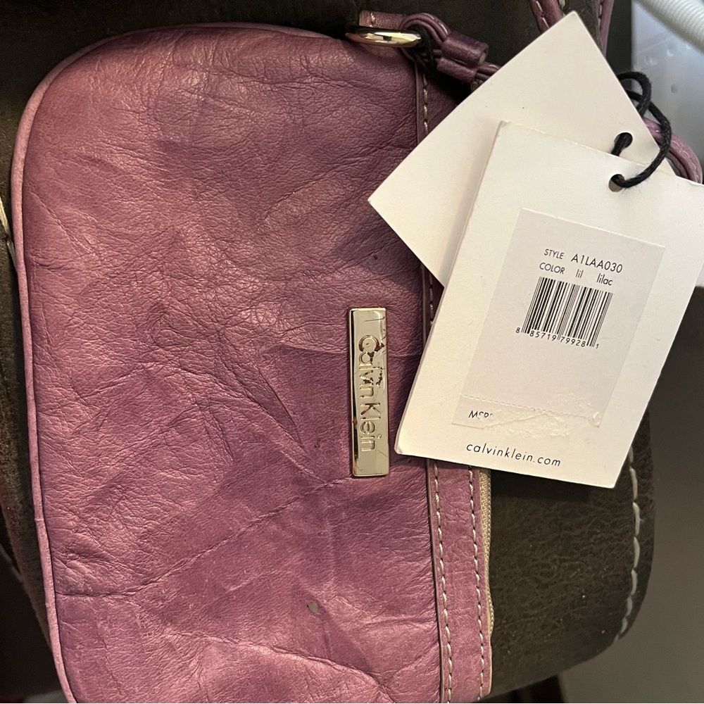 Calvin Klein Lilac Distressed Leather Wrislet. Never used, has tags.
